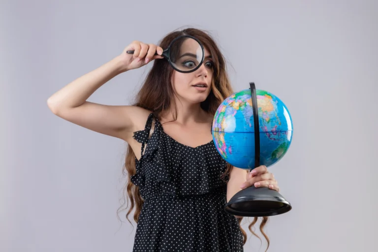 young-beautiful-girl-dress-polka-dot-looking-globe-through-magnifying-glass-intrigued-standing-white-background